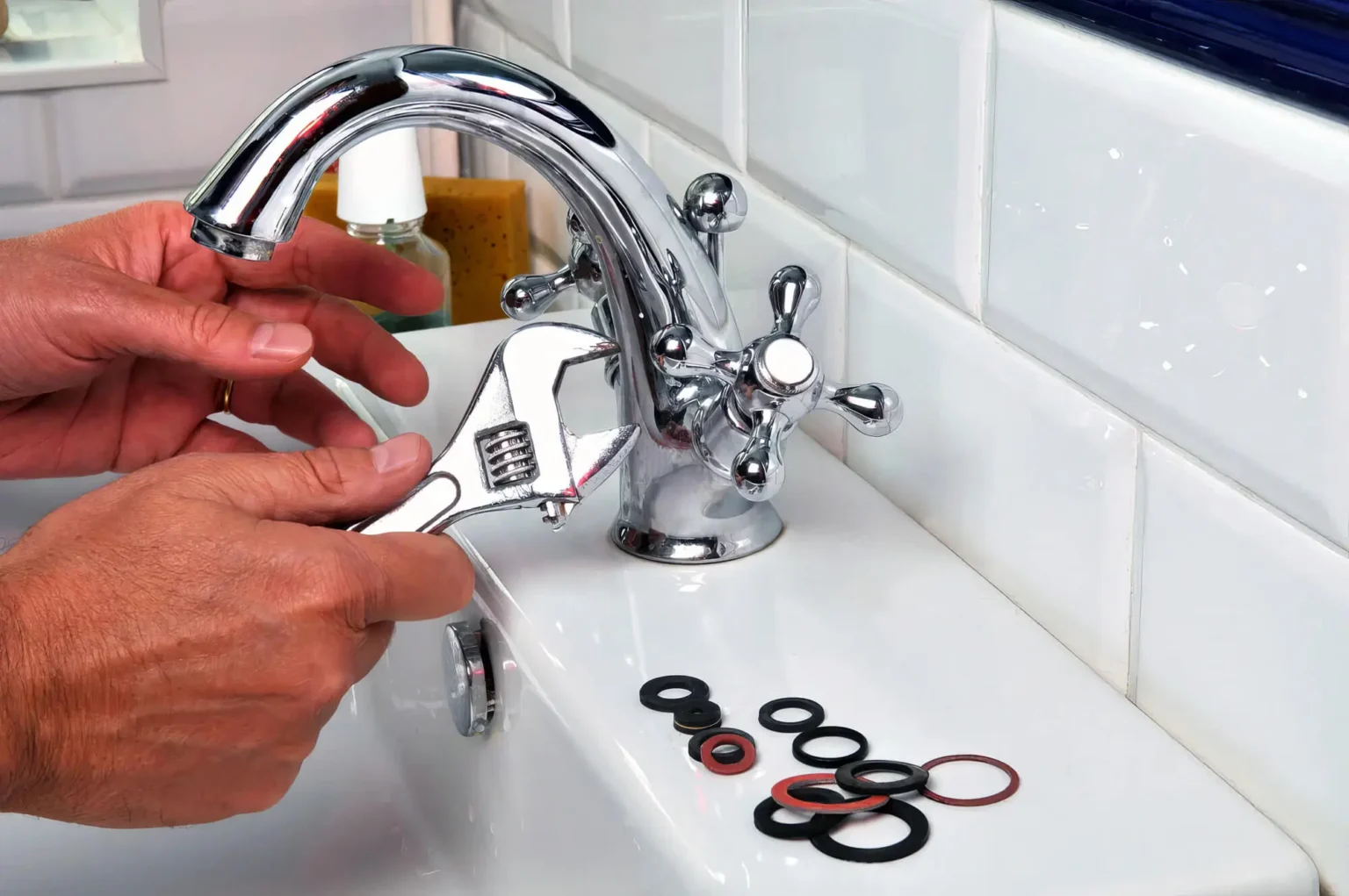 Plumber maintaining a bathroom faucet in Long Beach