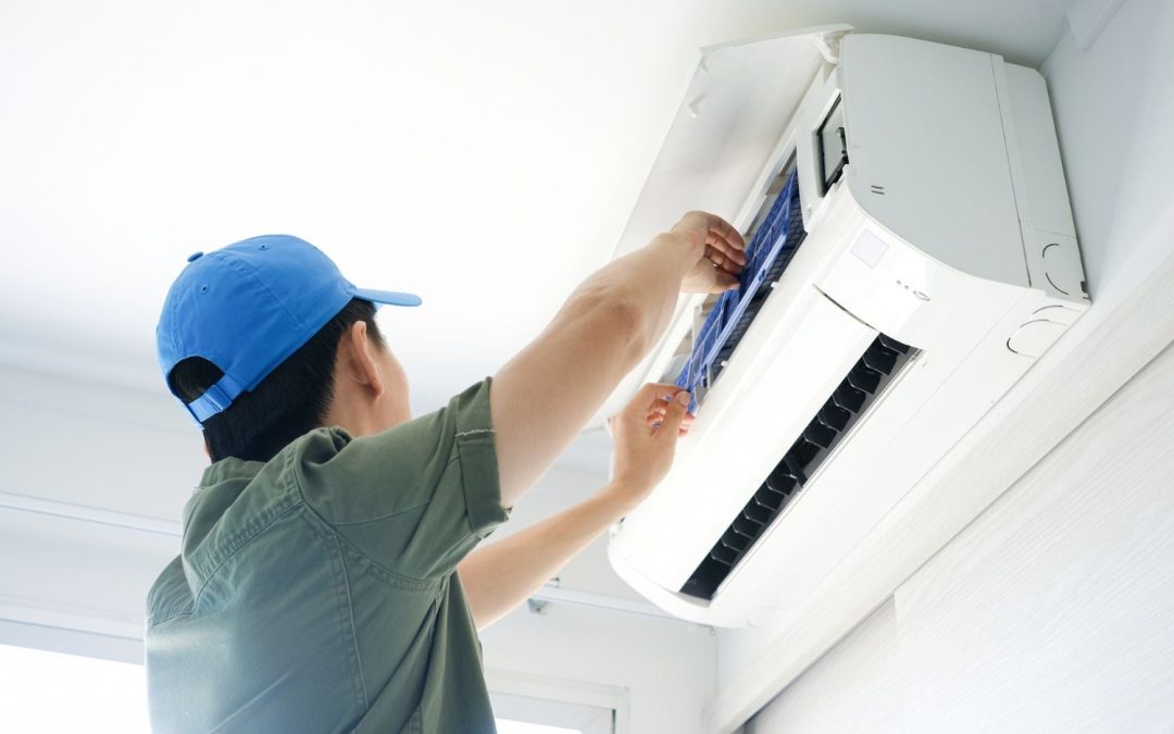 HVAC technician servicing a ductless mini split in Long Beach