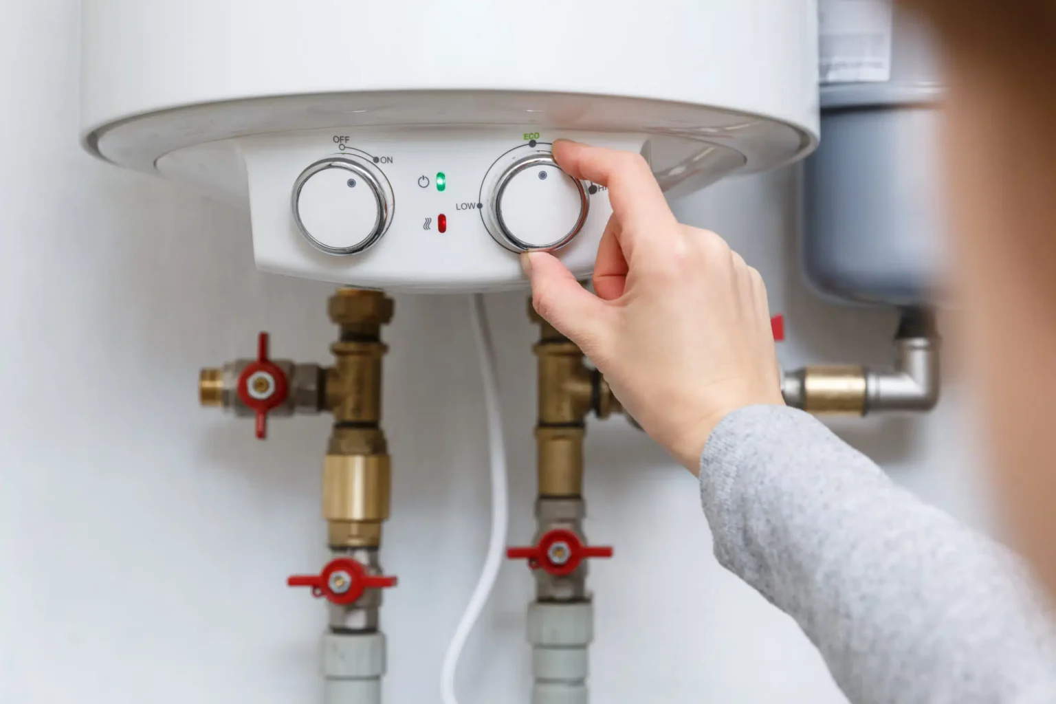 Technician adjusting a water heater in Long Beach
